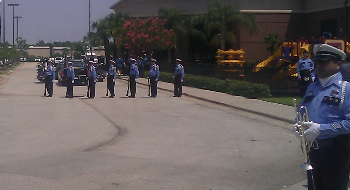 Honor Guard prepares to deliver Taps and Rifle Volley for Officer Henry Canales